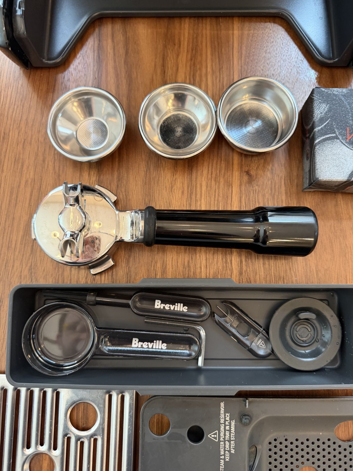 All filter baskets, bottomless portafilter, and original Breville tools
